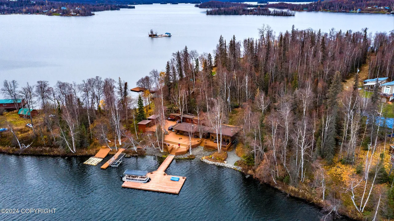 Aerial view of dock, pontoon, and lounge chairs
